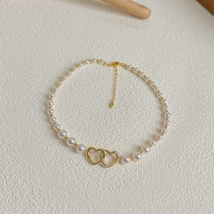 2023 French Style High-End Hollow Heart Pearl Choker Necklace - Short, Niche Design for Elegant Fashion